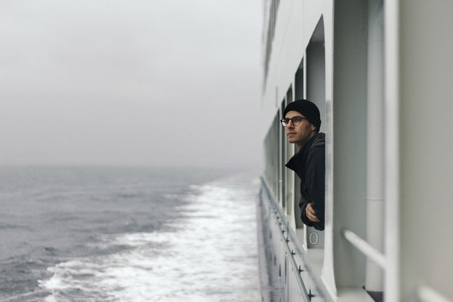 Person taking fresh air to get relief from seasickness